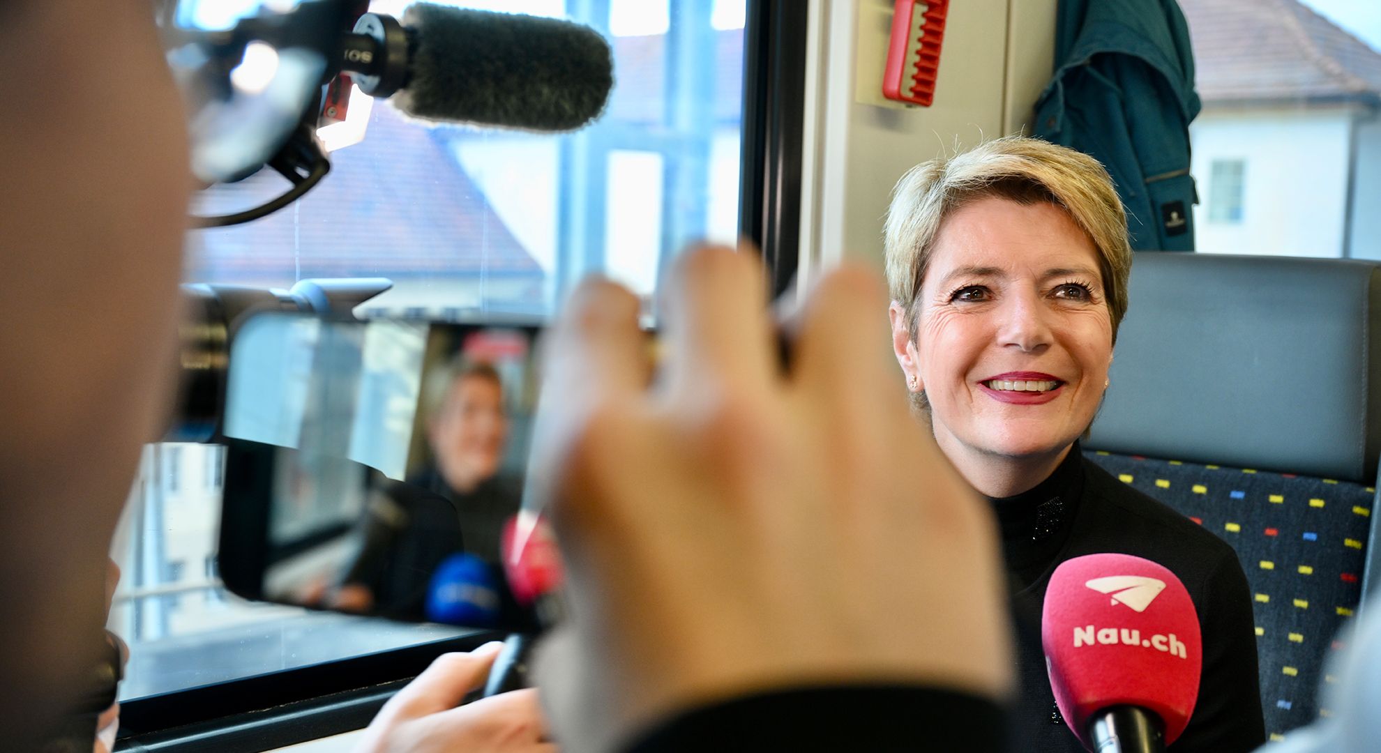 During the train ride to the 2025 presidency celebrations, Karin Keller-Sutter met the media
