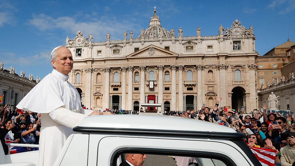 Pope Leo XIV greets the faithful upon his arrival in the popemobile in St. Peter's Square.